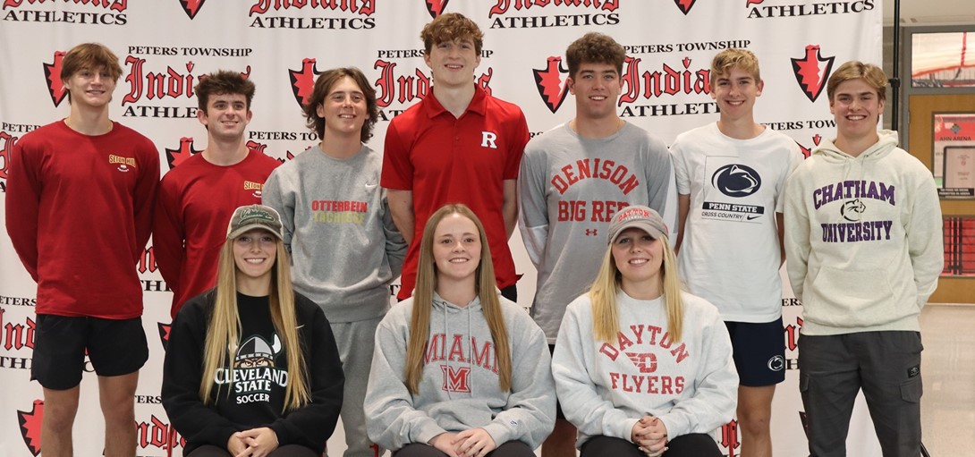 Students in their college gear for signing day