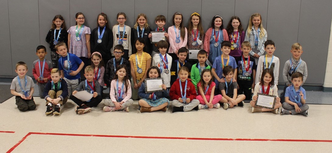 Students with their medals and awards.