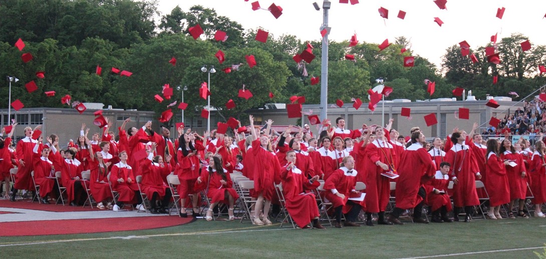 Students toss their caps at graduation