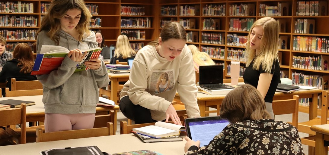 Students in the library doing research. 