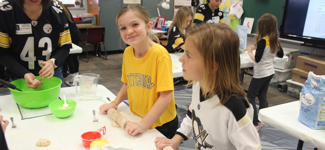 Students roll out dough for pierogies.