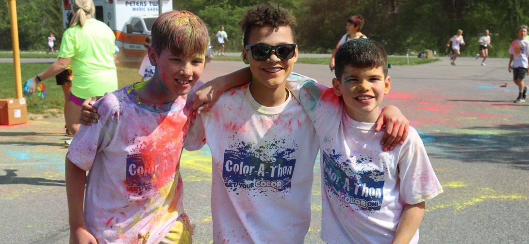 Students covered in color dust after the run