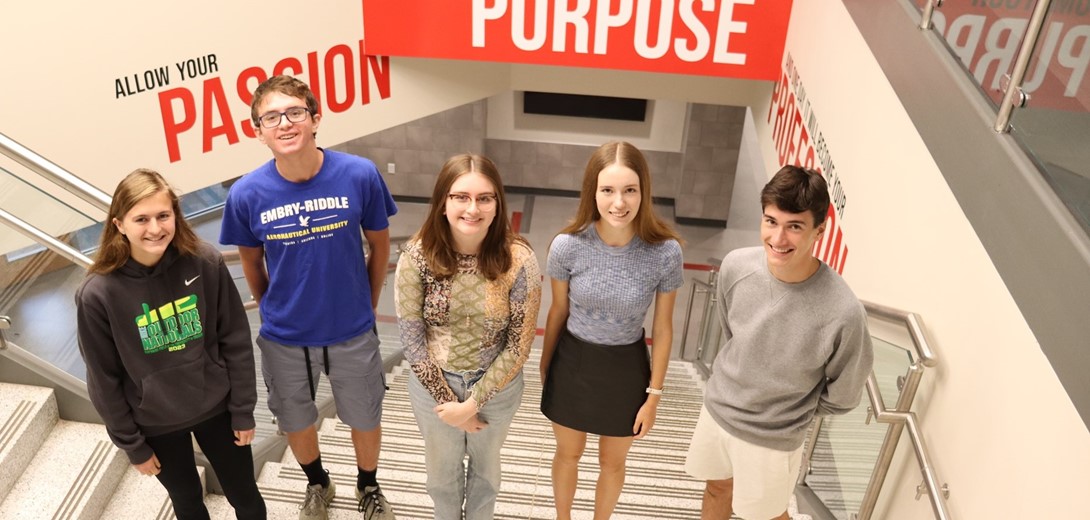 Students standing in the main staircase.