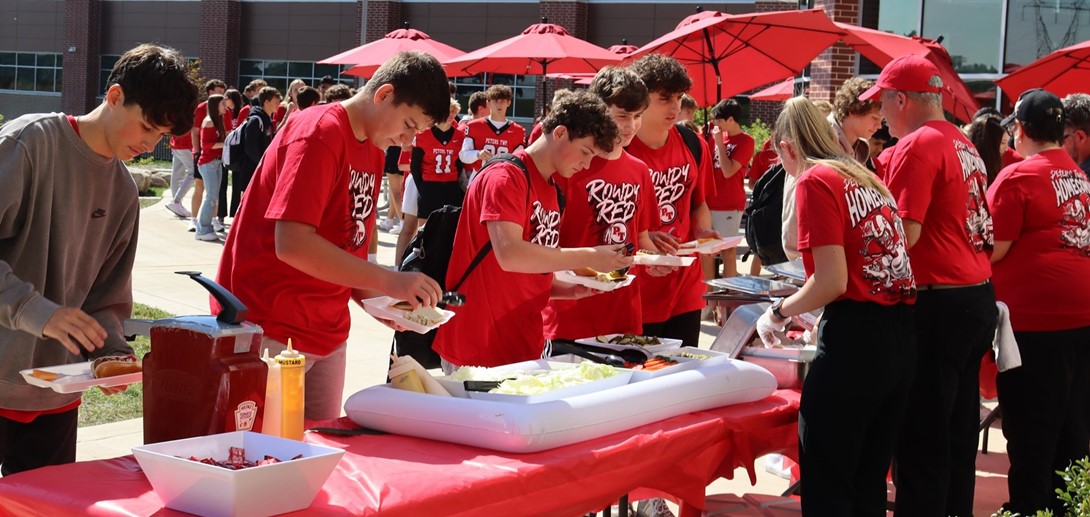 Students in line getting food for the cookout.