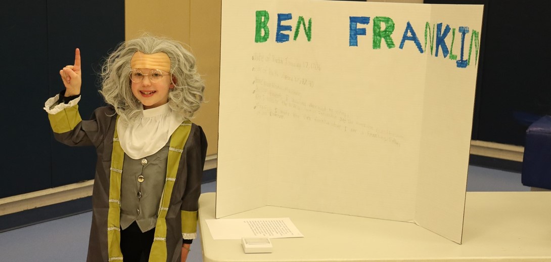 Student in a Ben Franklin costume ready to give her speech.